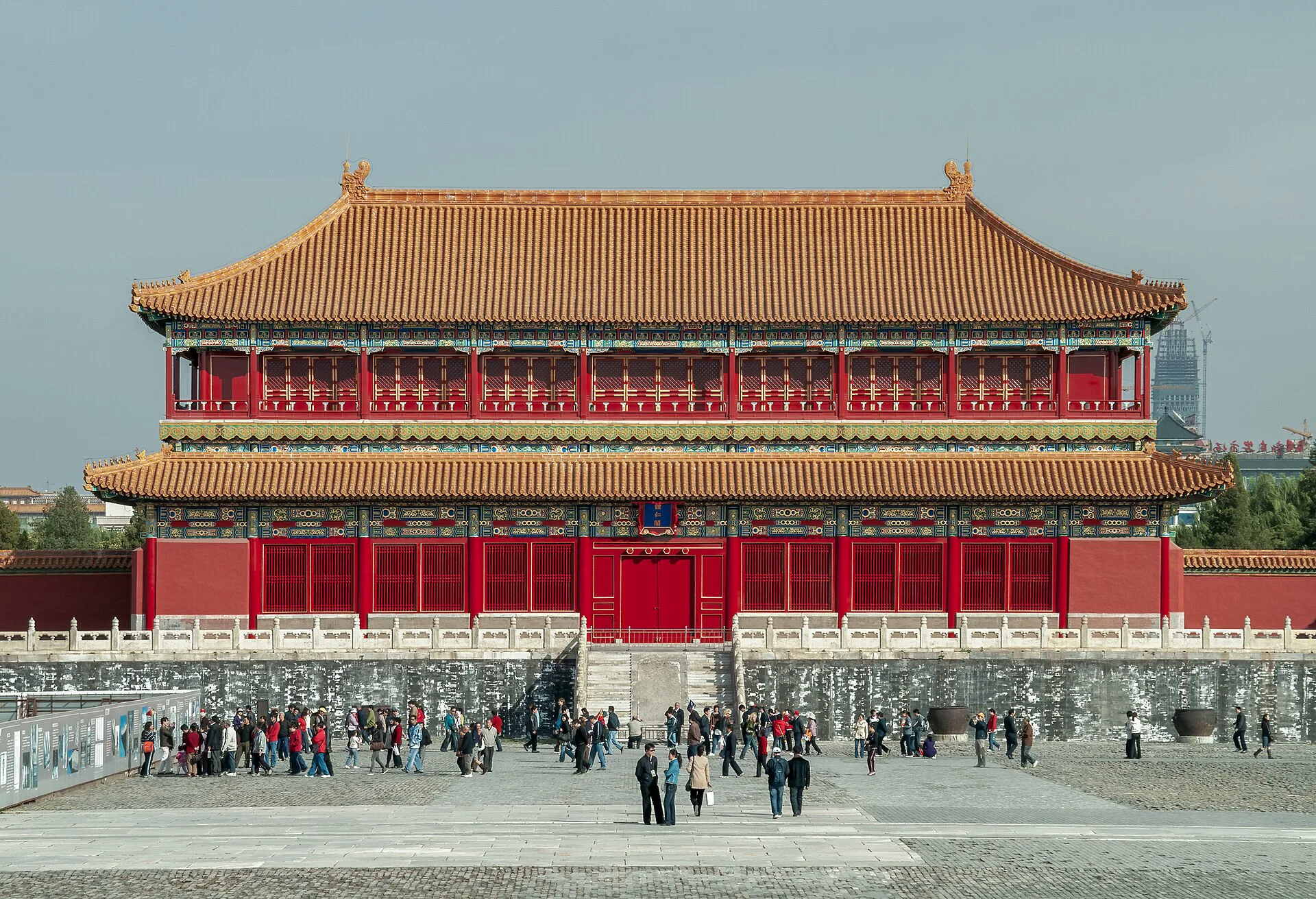 Red Forbidden City palace hall beyond white stone terraces