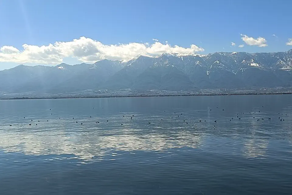 Erhai Lake reflecting the snow-dusted Cangshan mountains near Dali