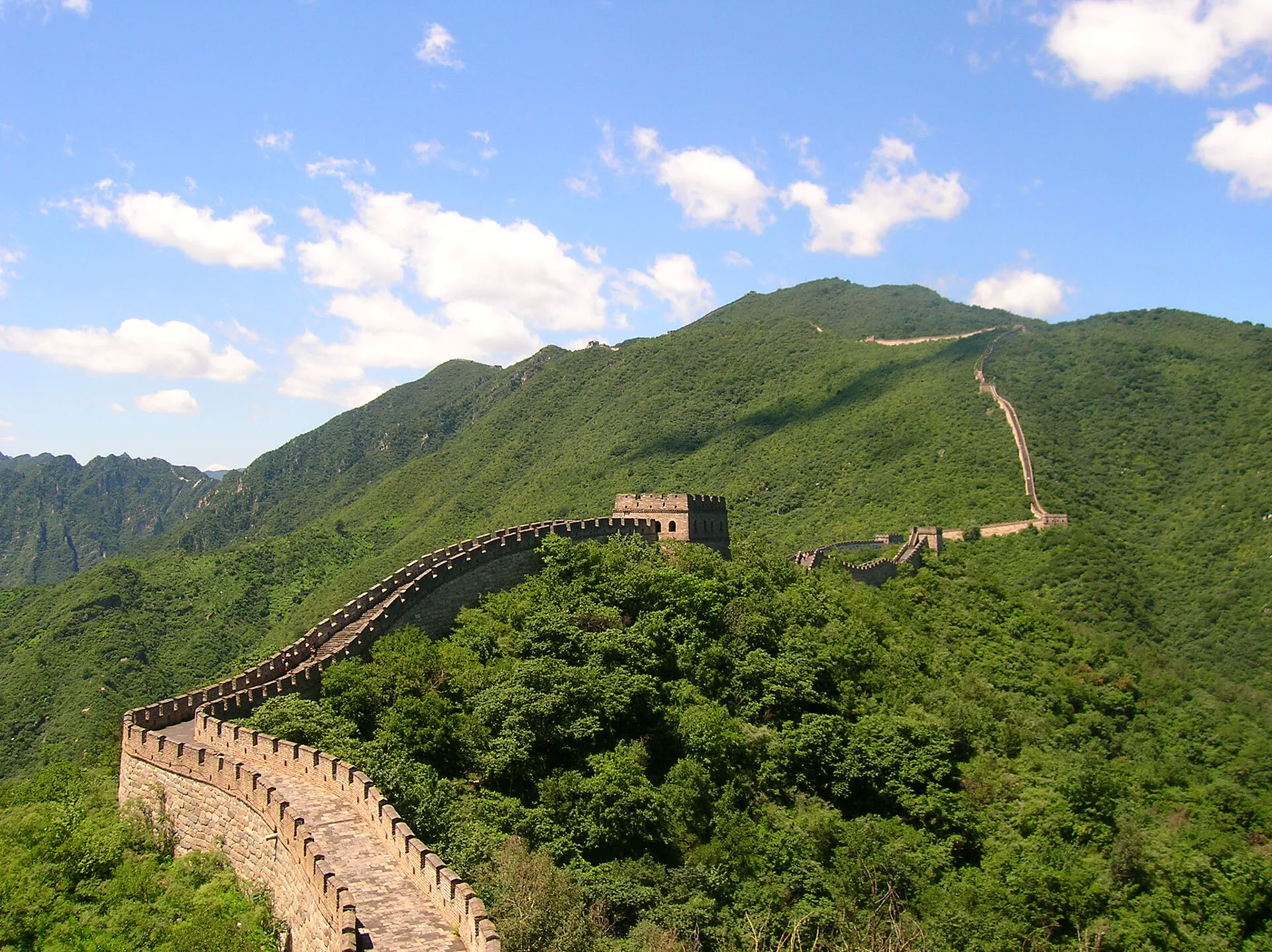 Great Wall watchtowers crossing a wooded mountain ridge near Beijing