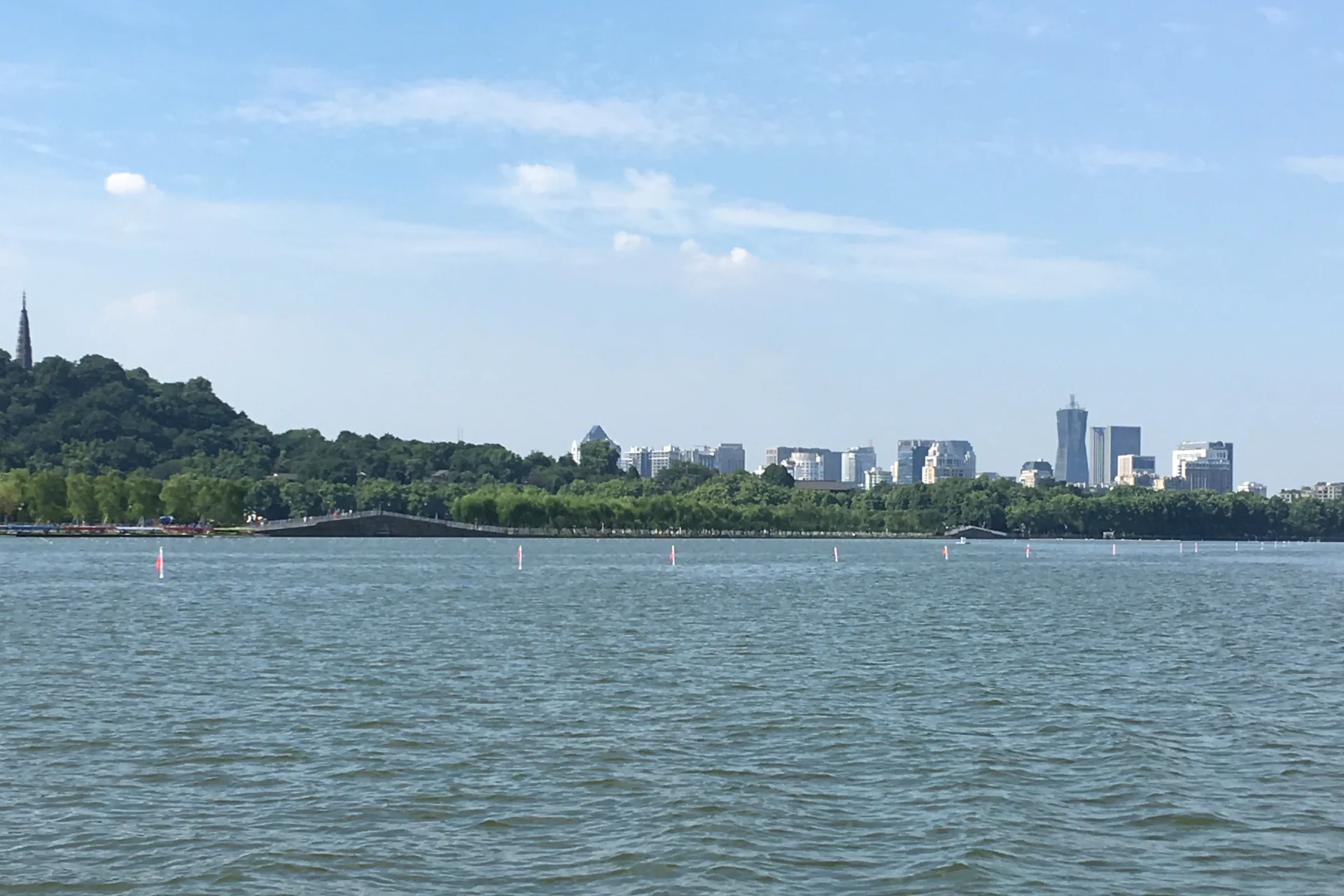West Lake opening toward the green hills and Hangzhou skyline