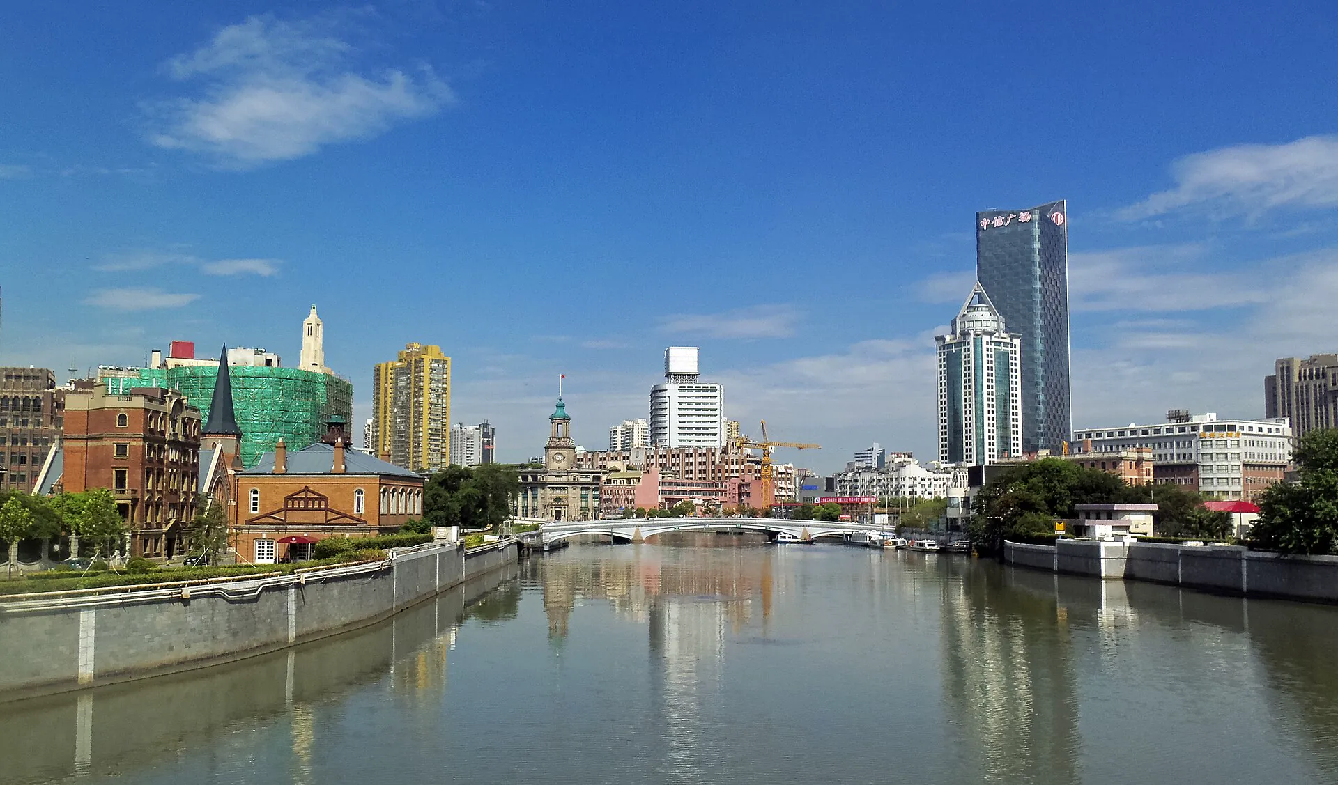 Suzhou Creek, historic riverfront buildings and modern towers seen from Waibaidu Bridge