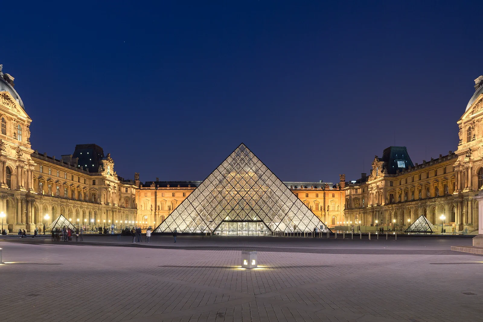 The Louvre pyramid and palace courtyard in Paris