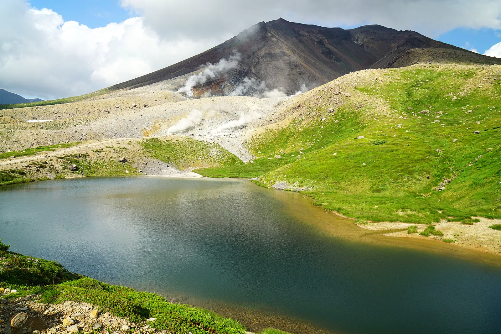Mount Asahidake and an alpine pond in Hokkaido