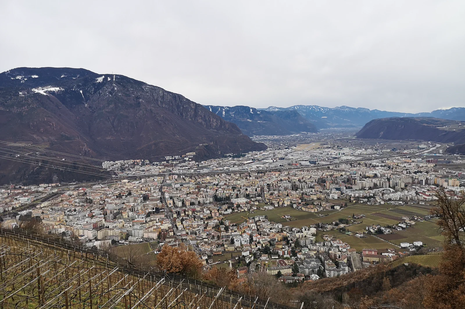 Bolzano below the Renon plateau and Dolomite landscape
