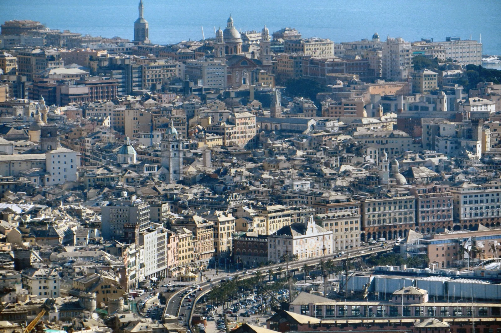 Genoa rising behind the Old Port with historic buildings on the slopes