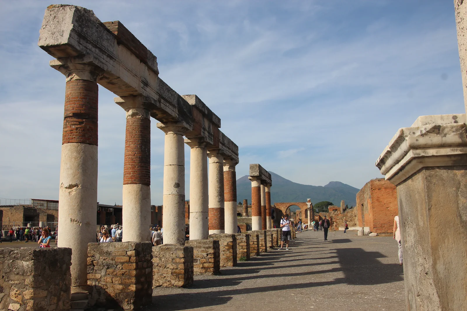 The excavated streets of Pompeii with Vesuvius beyond