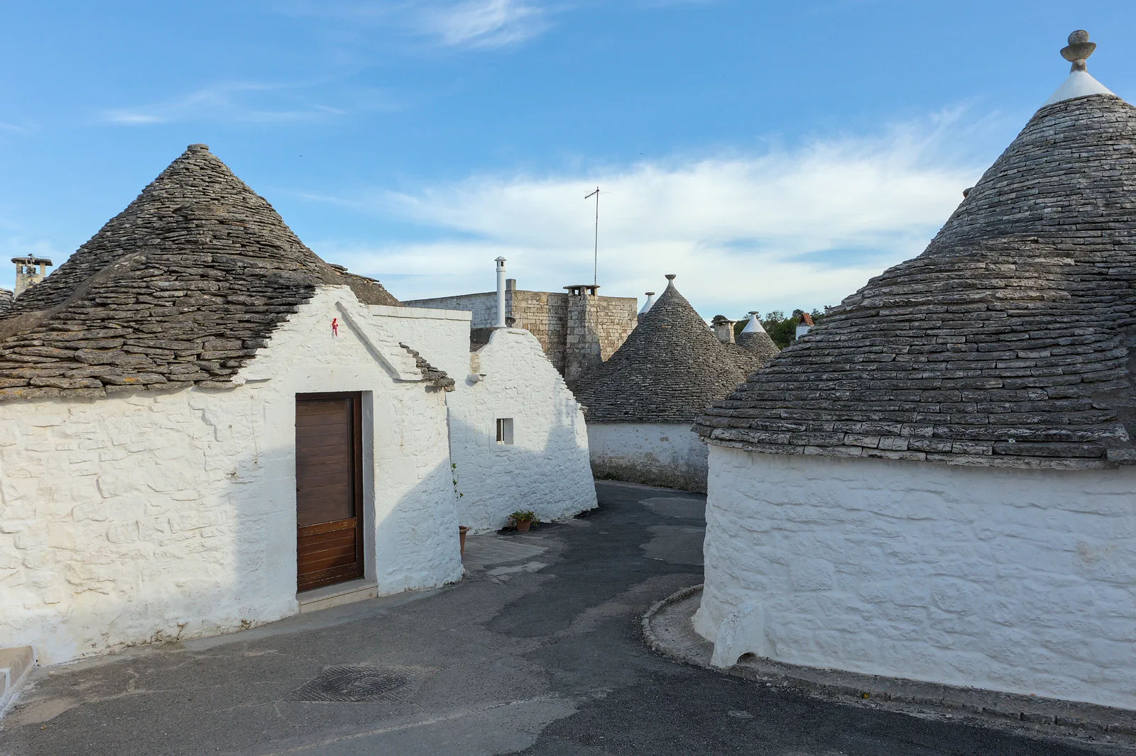 Whitewashed trulli roofs in Alberobello’s Aia Piccola district