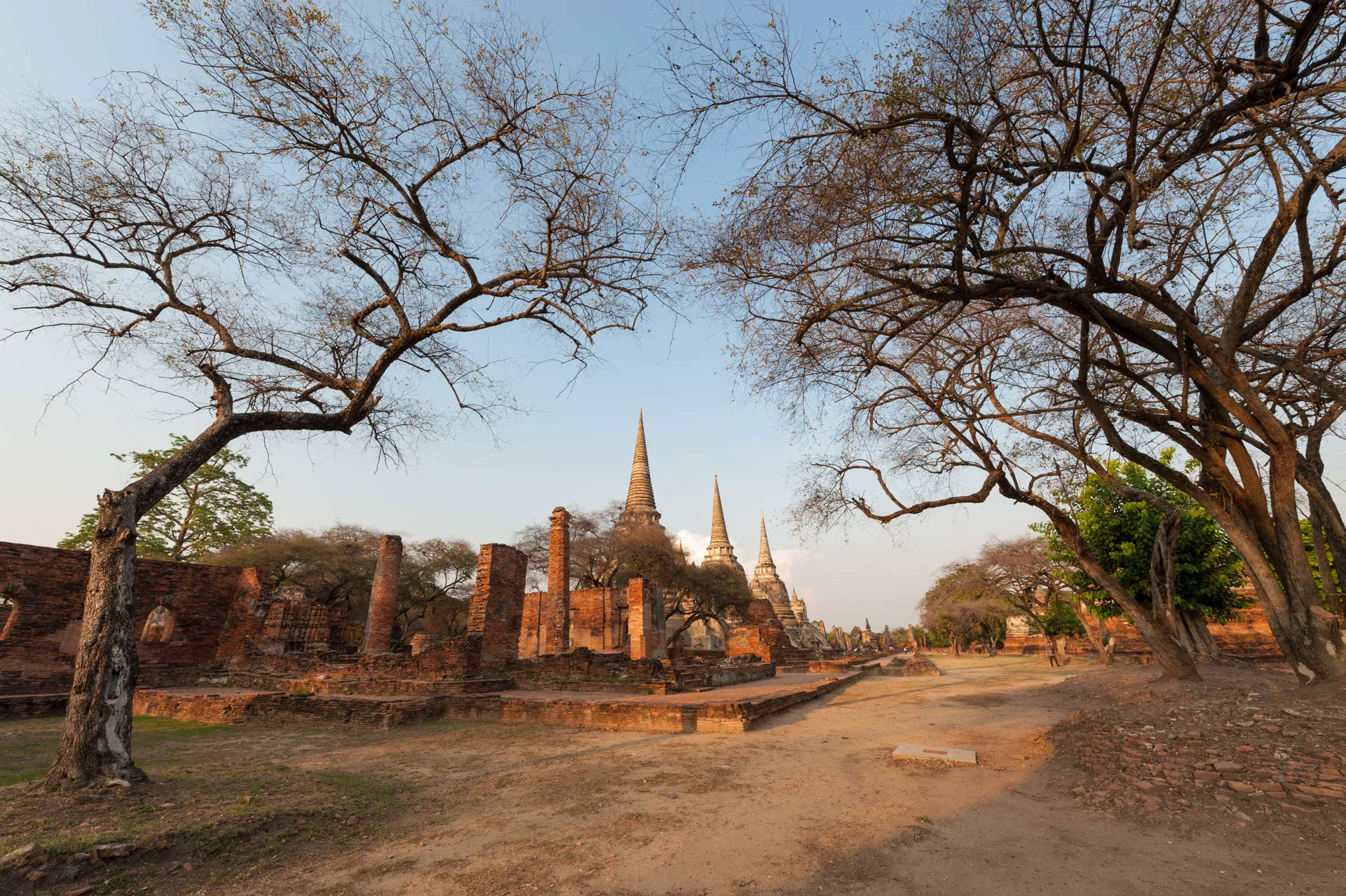 Three chedis and brick foundations at Wat Phra Si Sanphet in Ayutthaya