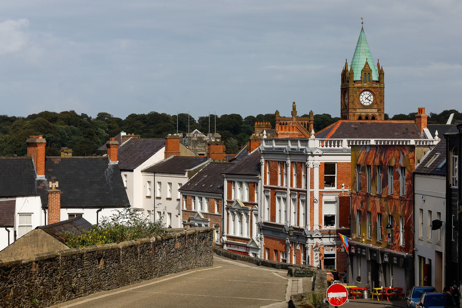 Historic city walls and central Derry beside the River Foyle