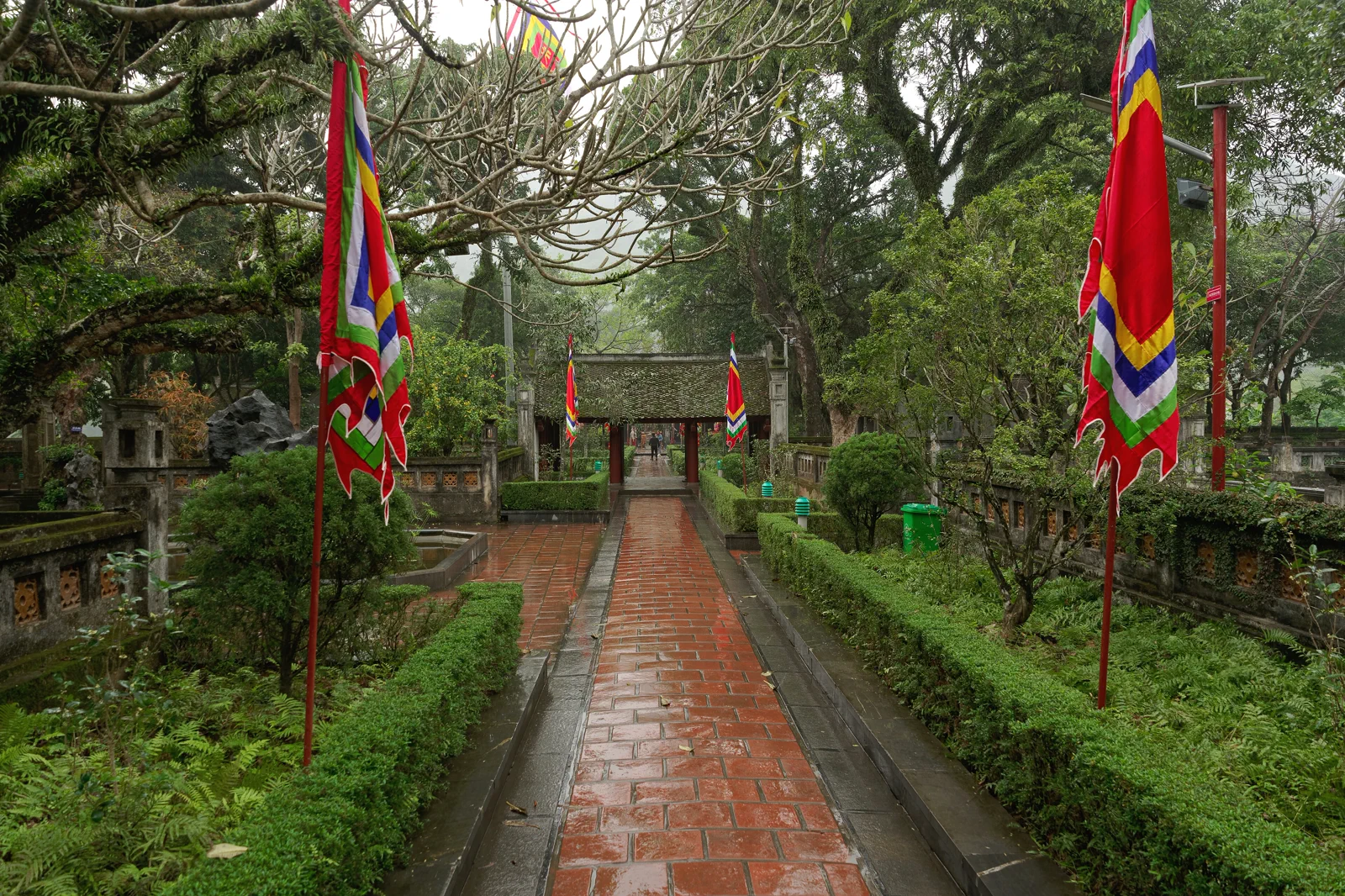 Flag-lined path to the Temple of Emperor Le Dai Hanh at Hoa Lu